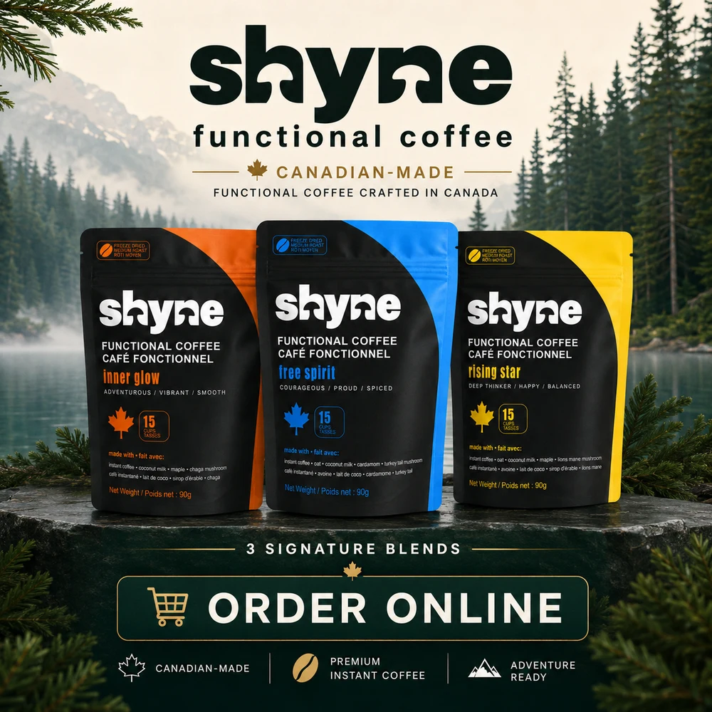Three Shyne functional coffee pouches in front of a Canadian mountain lake with an Order Online call-to-action